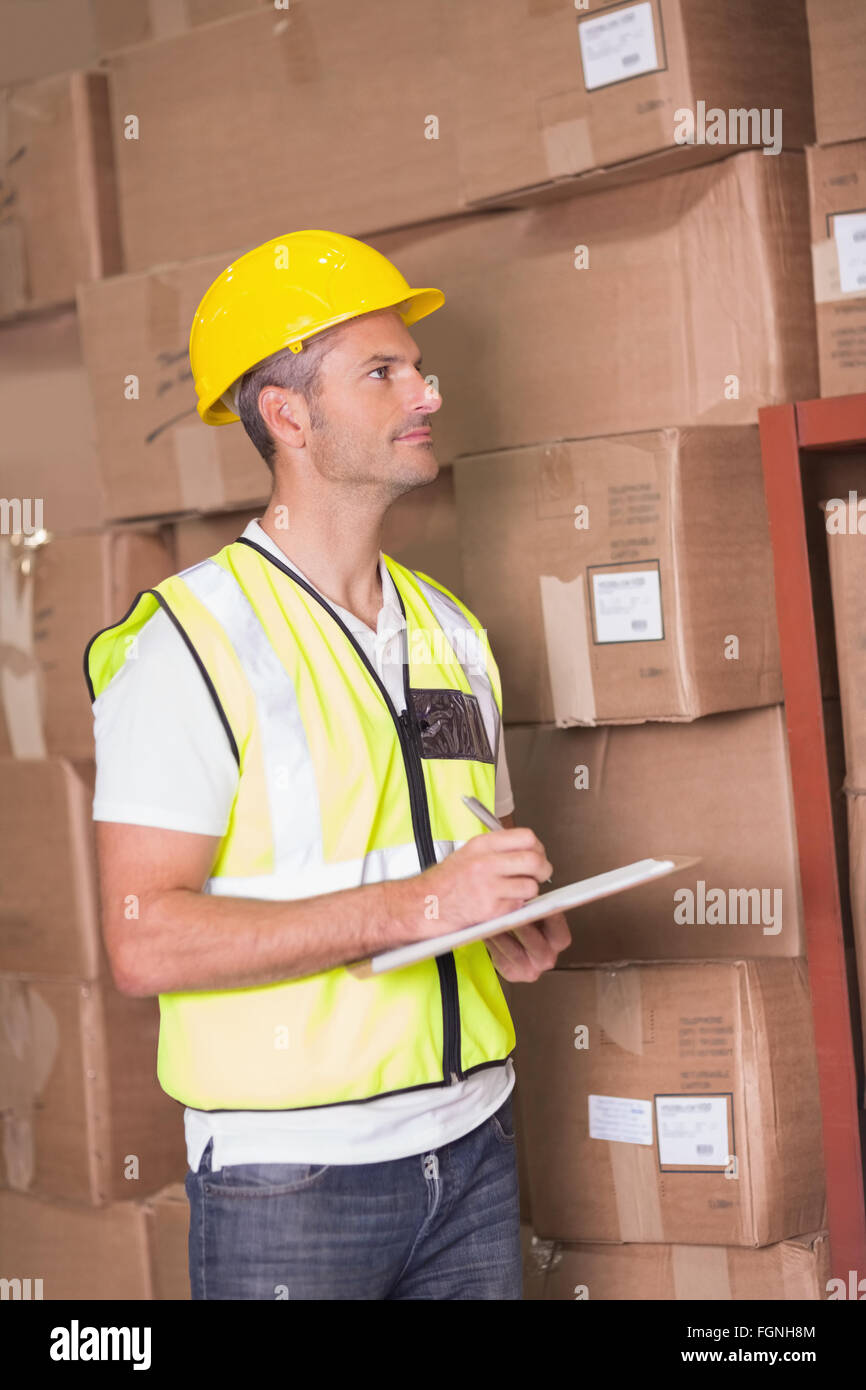 Warehouse worker with clipboard Stock Photo