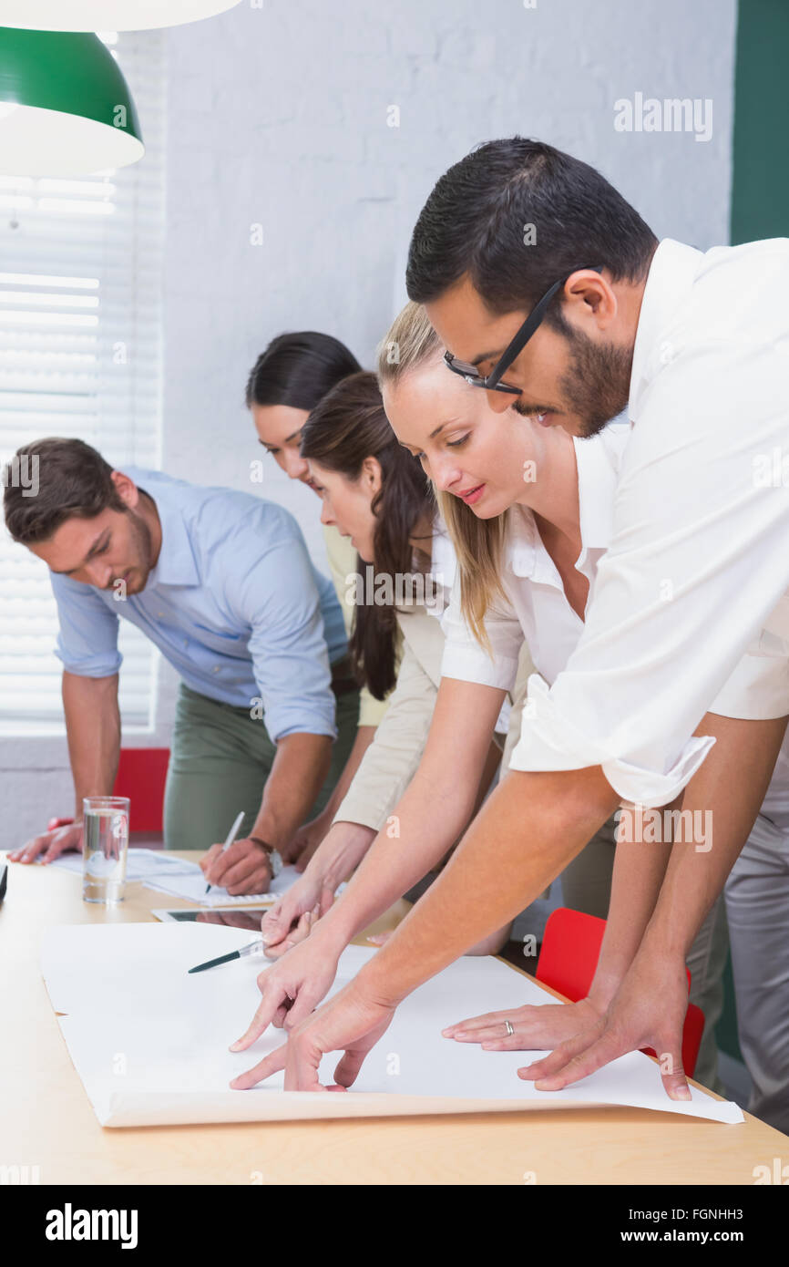 Team architects going over blueprints hi-res stock photography and ...