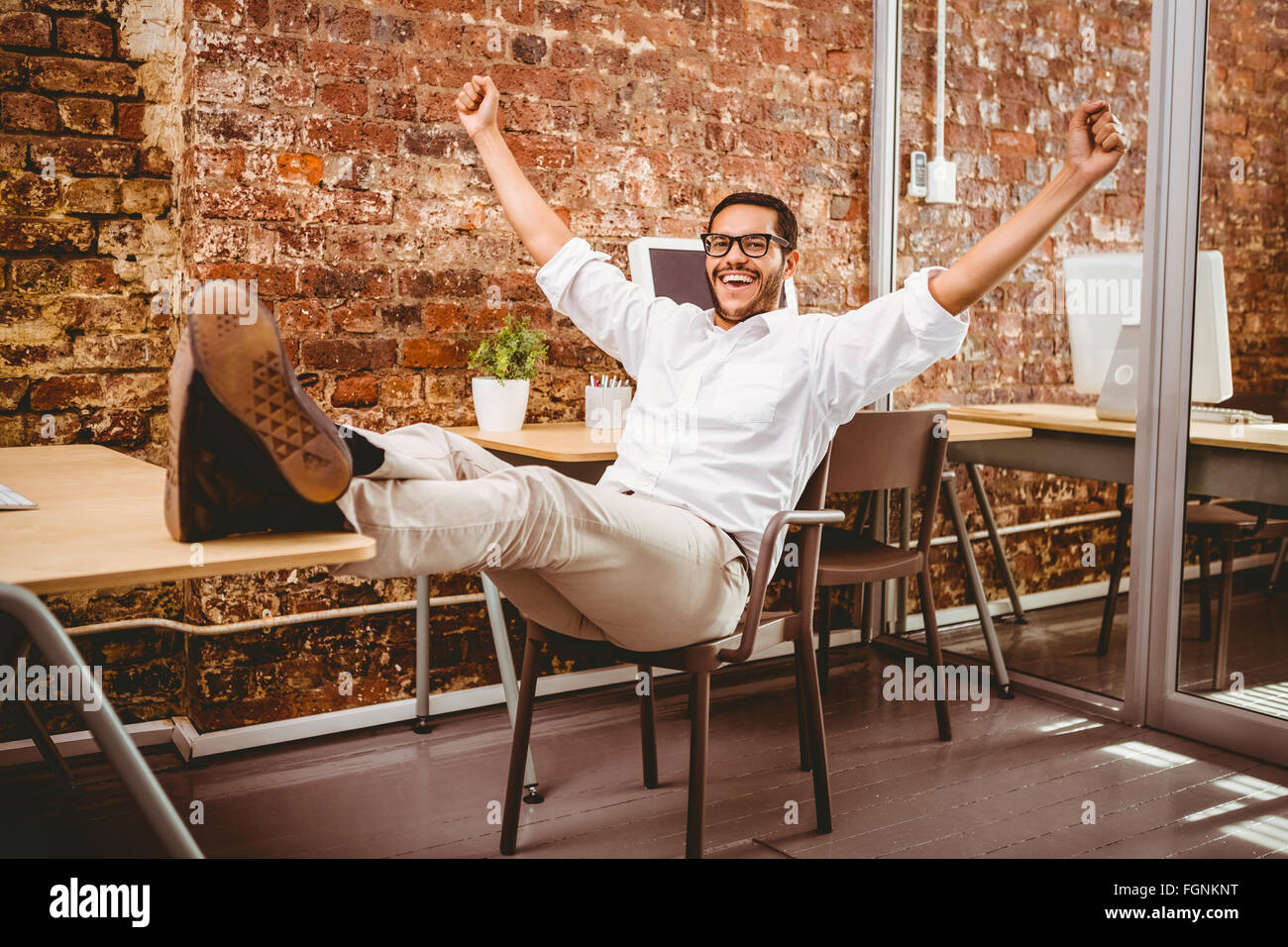 Mixed race man cheering office hi-res stock photography and images - Alamy