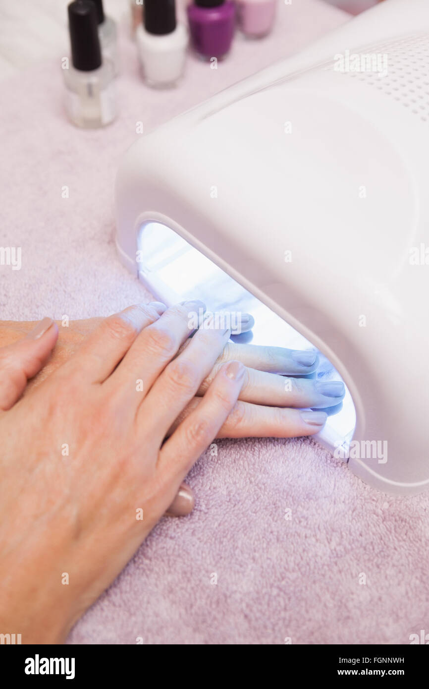 Customer drying their painted nails Stock Photo Alamy