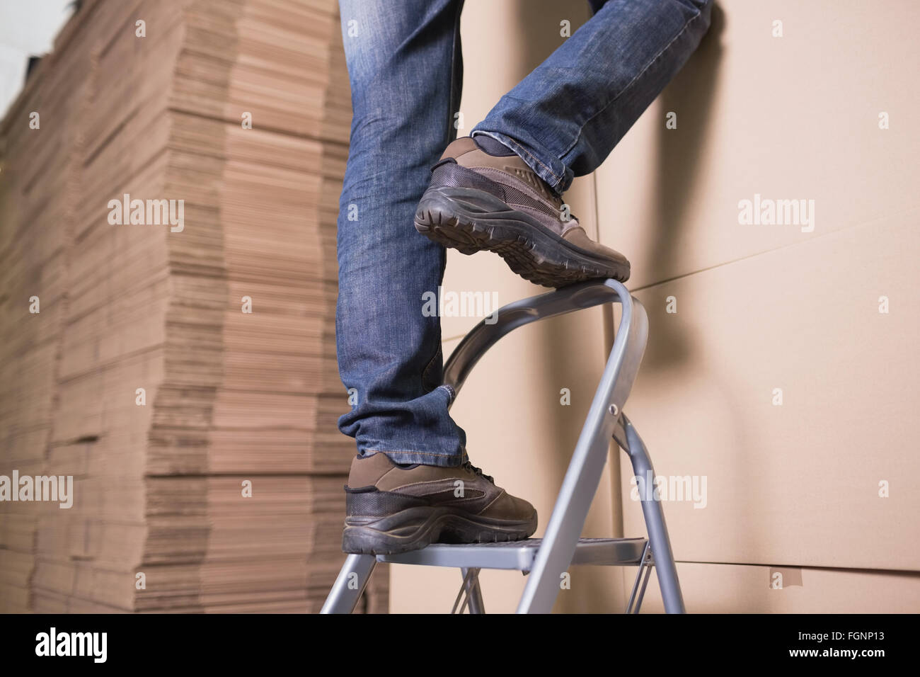 Ladder Work Stock Image Worker on ladder in warehouse Stock Photo - Alamy