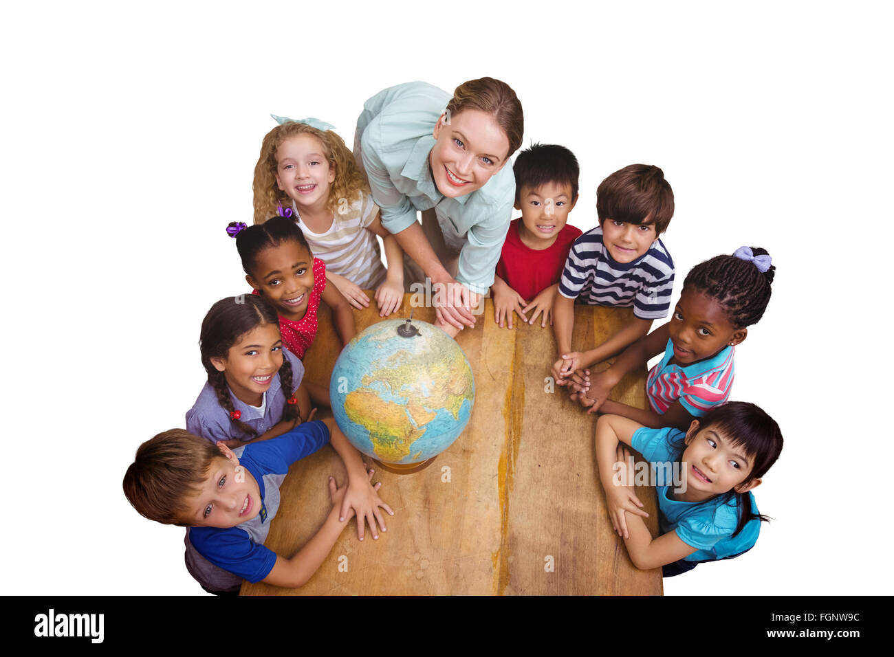 Composite image of cute pupils smiling around a globe in classroom with ...