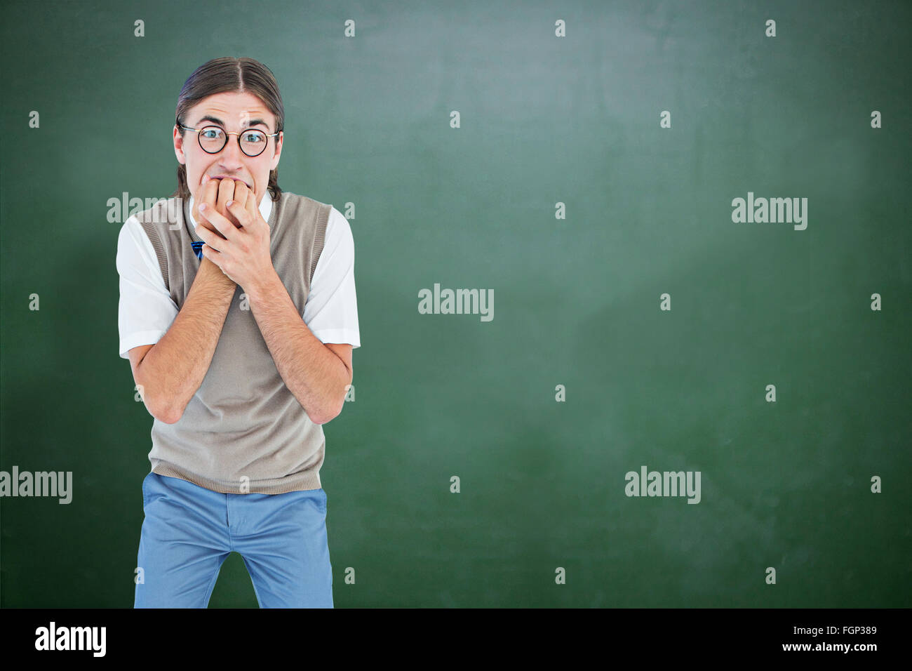 Composite image of geeky hipster looking nervously at camera Stock ...