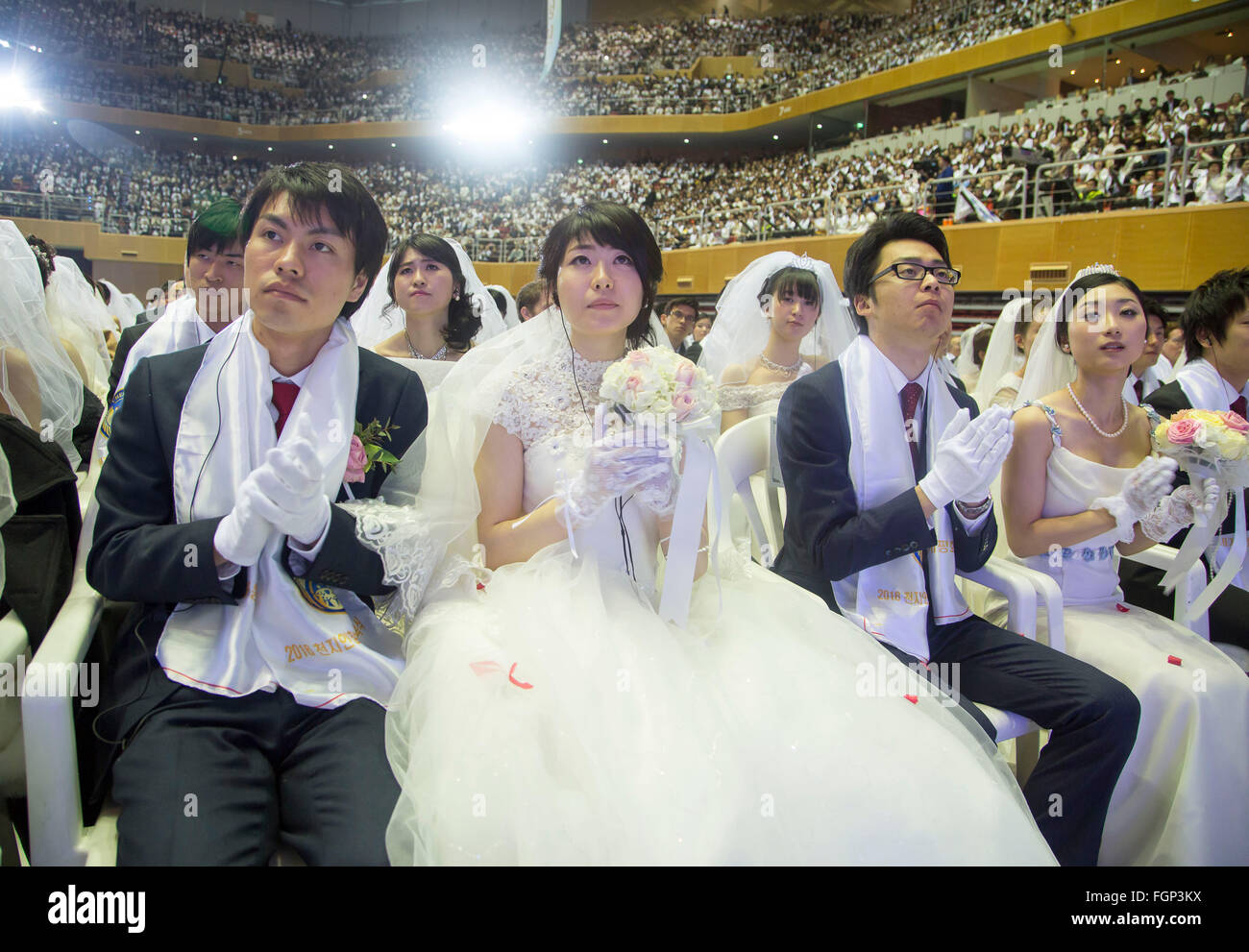 Unification Church's mass wedding, Feb 20, 2016 : Newlyweds participate in a mass wedding ceremony of the Unification Church at the Cheong Shim Peace World Center in Gapyeong, about 60 km (37 miles) east of Seoul, South Korea.The church said about 3,000 couples from more than 60 countries participated in the mass wedding in Gapyeong and other 12,000 couples attended in the wedding ceremony through live-streamed broadcast, which was organized by Han Hak-Ja, widow of the late Rev. Moon Sun-Myung, founder of the Unification Church. © Lee Jae-Won/AFLO/Alamy Live News Stock Photo