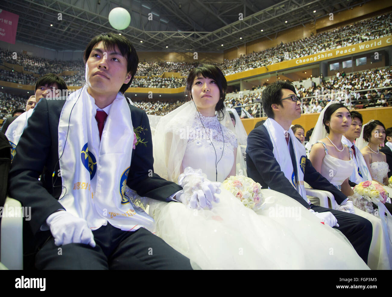 Unification Church's mass wedding, Feb 20, 2016 : Newlyweds participate in a mass wedding ceremony of the Unification Church at the Cheong Shim Peace World Center in Gapyeong, about 60 km (37 miles) east of Seoul, South Korea.The church said about 3,000 couples from more than 60 countries participated in the mass wedding in Gapyeong and other 12,000 couples attended in the wedding ceremony through live-streamed broadcast, which was organized by Han Hak-Ja, widow of the late Rev. Moon Sun-Myung, founder of the Unification Church. © Lee Jae-Won/AFLO/Alamy Live News Stock Photo