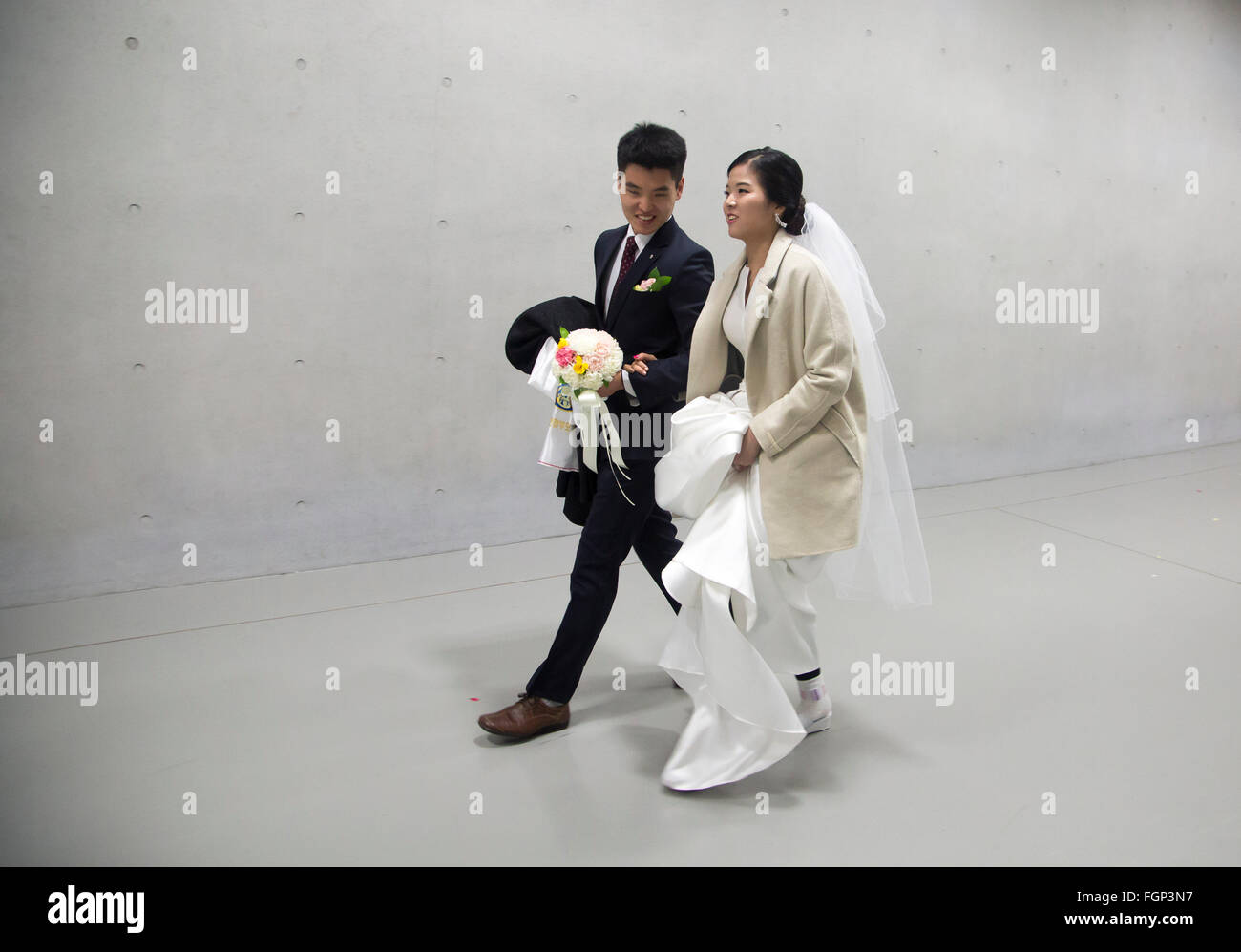 Unification Church's mass wedding, Feb 20, 2016 : Newlyweds walk after a mass wedding ceremony of the Unification Church at the Cheong Shim Peace World Center in Gapyeong, about 60 km (37 miles) east of Seoul, South Korea.The church said about 3,000 couples from more than 60 countries participated in the mass wedding in Gapyeong and other 12,000 couples attended in the wedding ceremony through live-streamed broadcast, which was organized by Han Hak-Ja, widow of the late Rev. Moon Sun-Myung, founder of the Unification Church. © Lee Jae-Won/AFLO/Alamy Live News Stock Photo