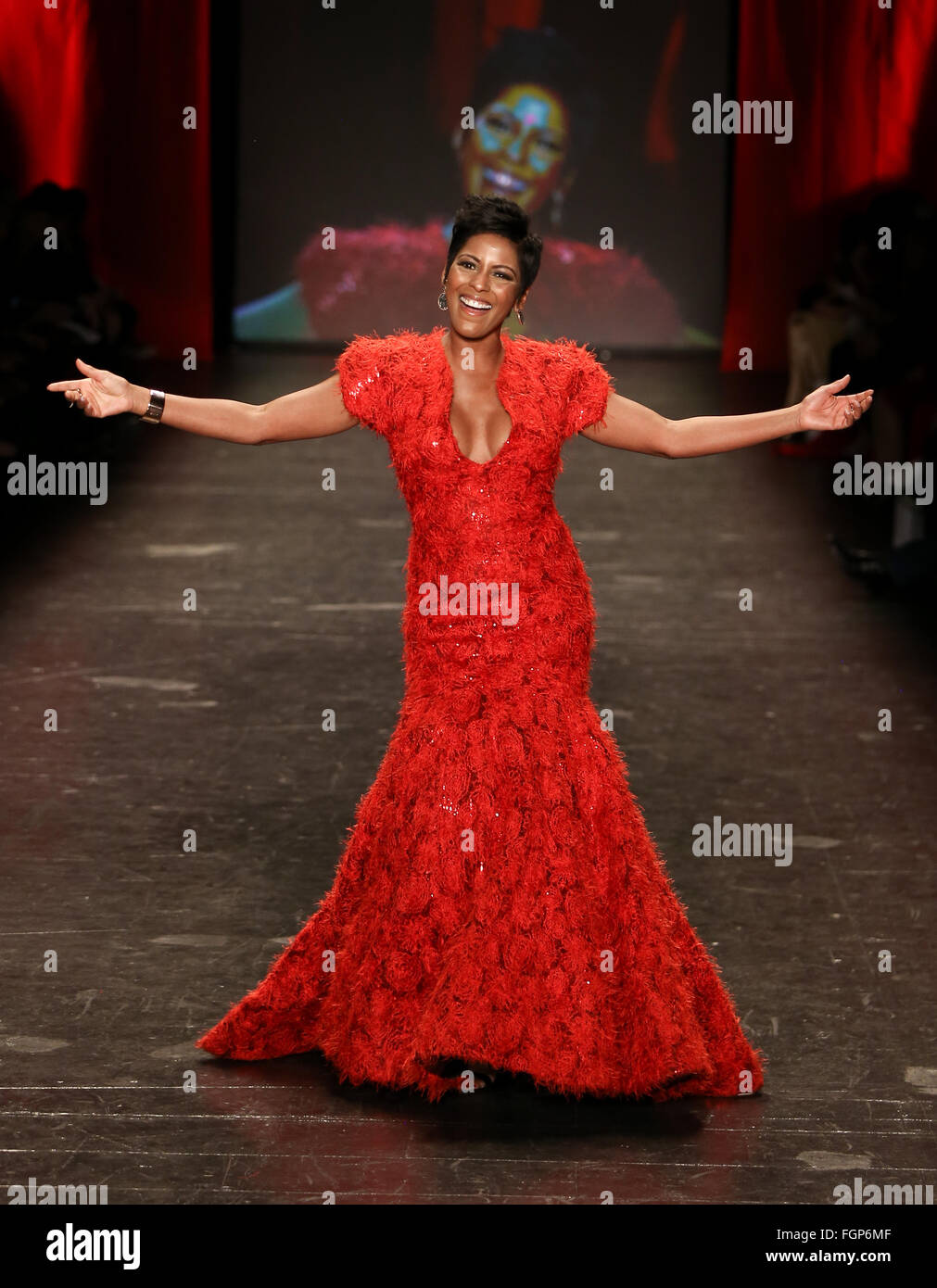 Tamron Hall wears Romona Keveza at Go Red for Women Red Dress Collection 2016 Presented by Macy's at New York Fashion Week. Stock Photo