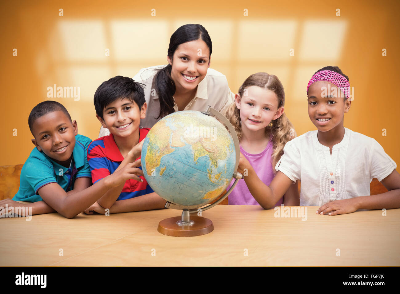 Composite image of cute pupils and teacher looking at globe in library ...