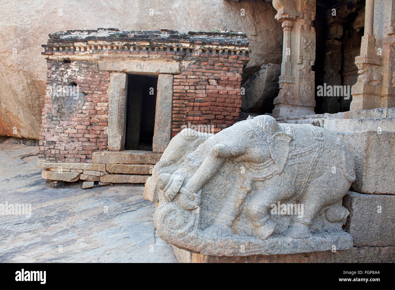 Elephant balustrades and unfinished red brick wall temple Lepakshi Temple, Anantapur District, Andhra Pradesh, India Stock Photo