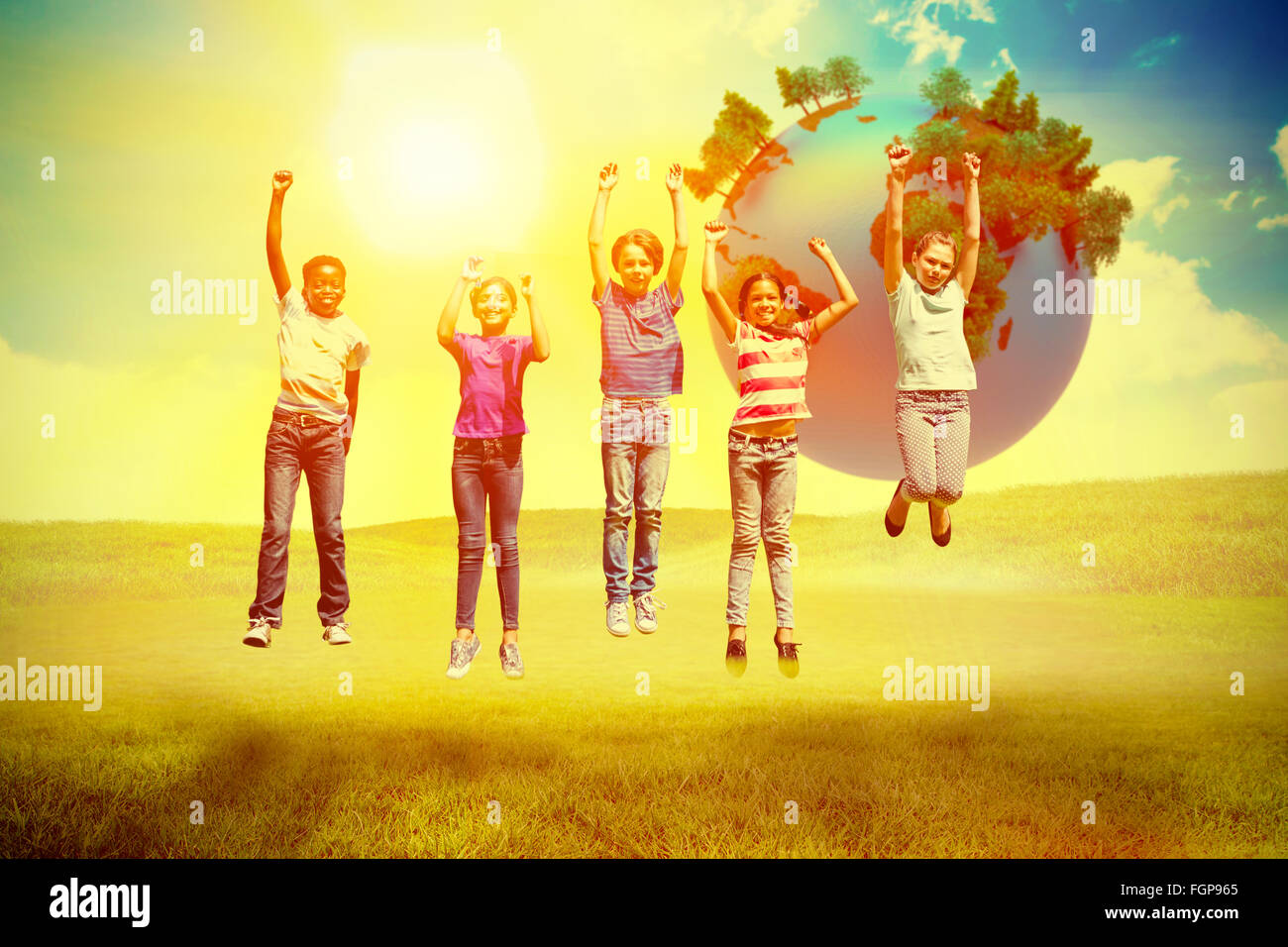 Composite image of children jumping at park Stock Photo - Alamy