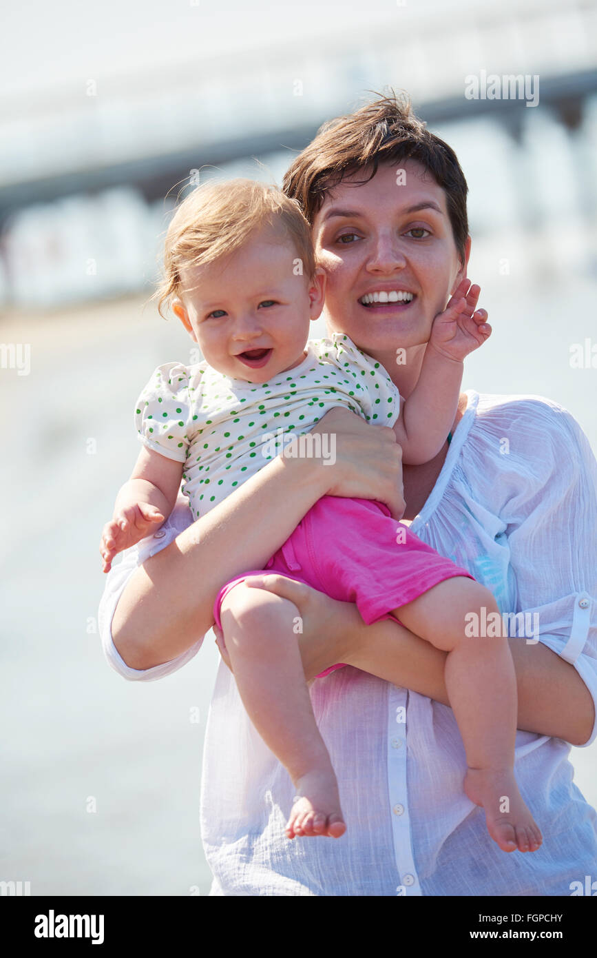 mom and baby on beach have fun Stock Photo Alamy
