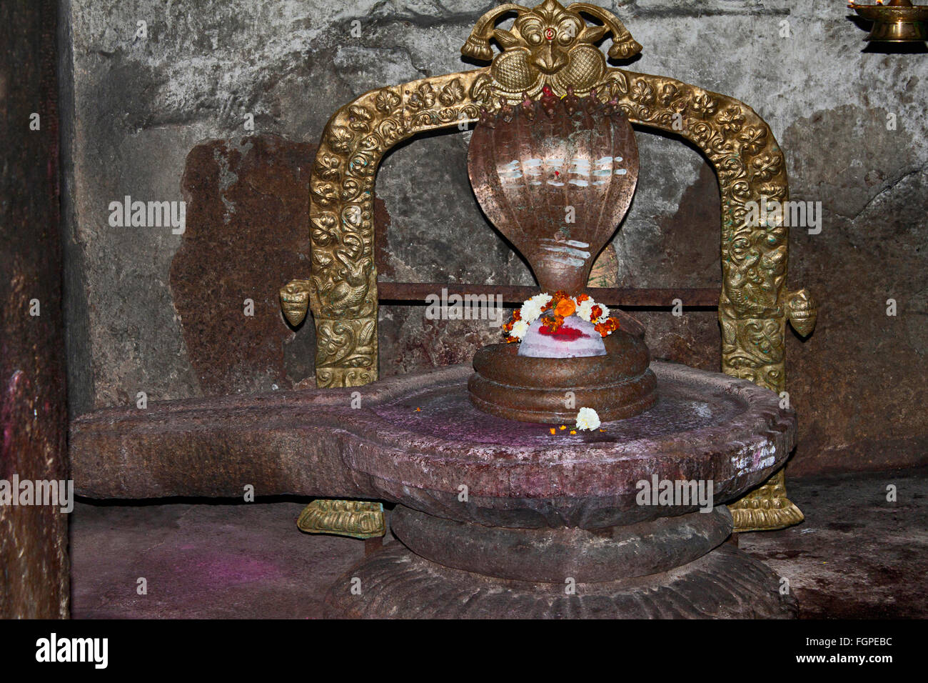 Small shiv linga with seven-hooded Naga sheltering a white lingam ...