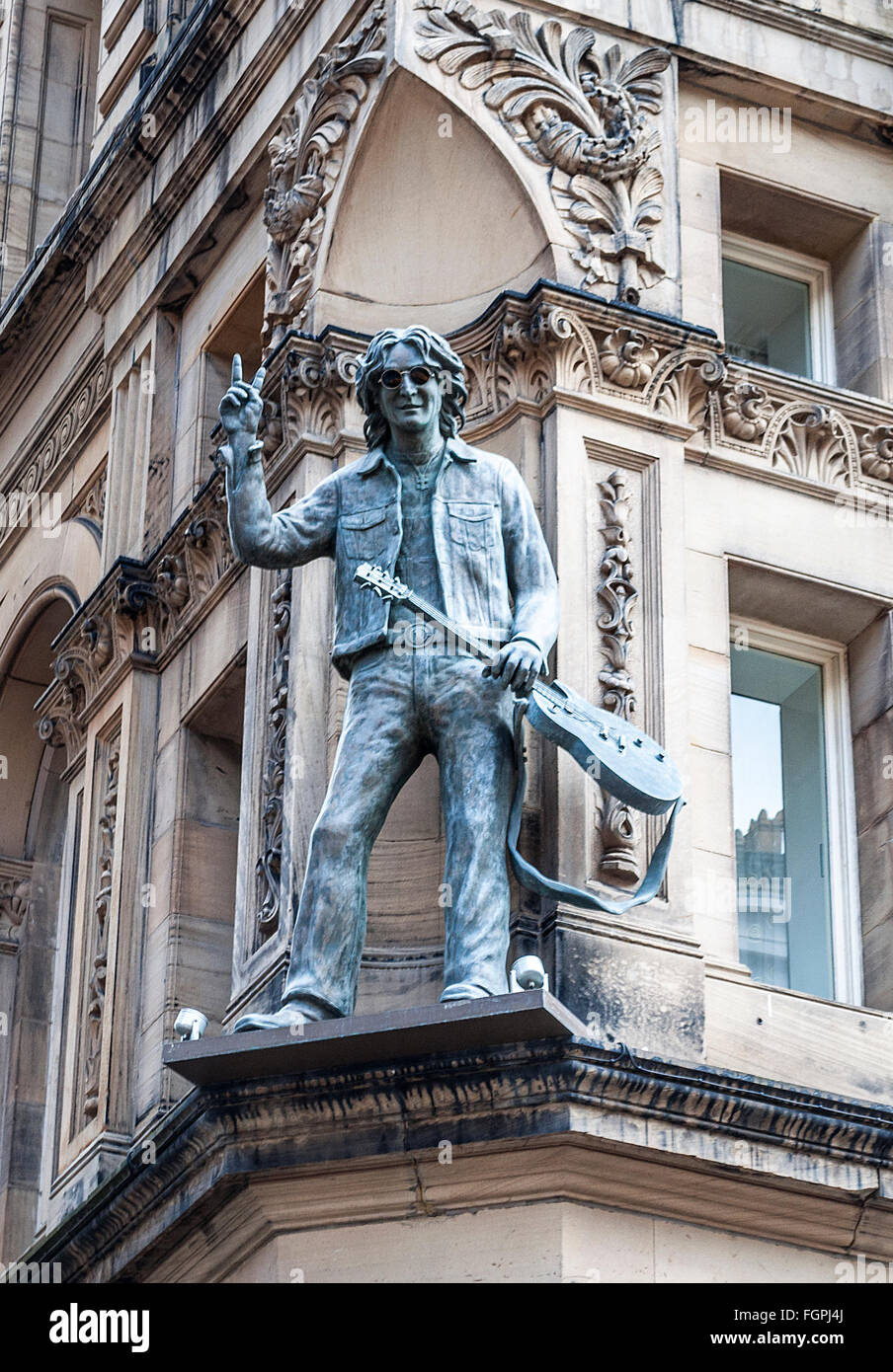 Statue of John Lennon on the " Hard Days Night " hotel in Liverpool, UK