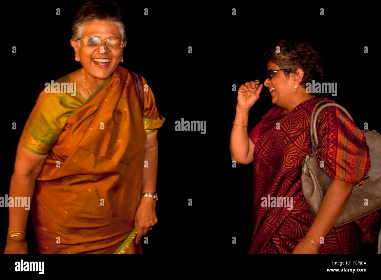 Two old indian ladies laughing away at a joke, Karnataka, India Stock Photo