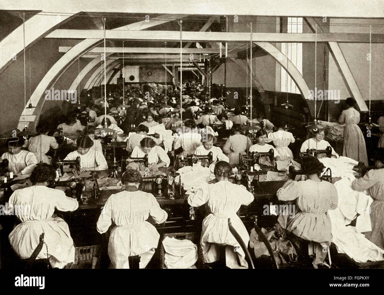 people, profession, seamstress, sempstresses at sewing machines sewing work clothes, apron, stockings, wool, hosiery, notions in the textile factory of F. W. Brueggelmann and sons, overview across the sewing hall, Cologne, Germany, 1913, Additional-Rights-Clearences-Not Available Stock Photo