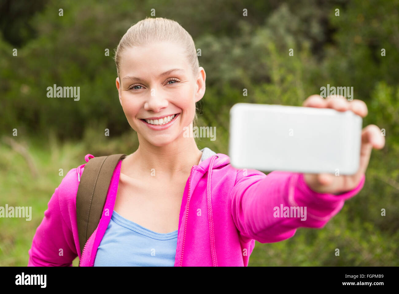 Cheerful female hiker taking selfie hi-res stock photography and images ...