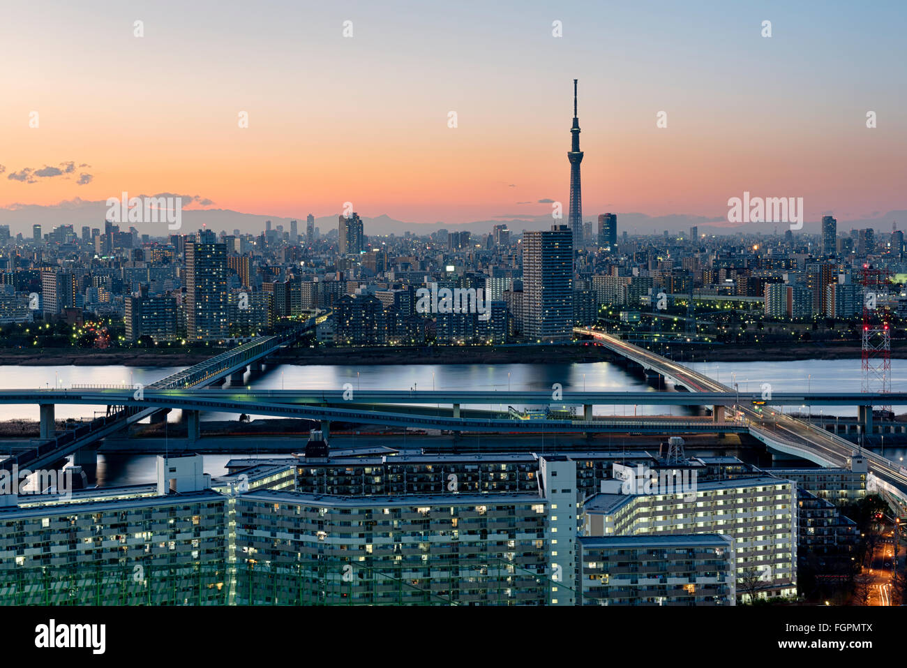 Tokyo; Japan -January 10; 2016: Tokyo Skyline at dusk, view of Asakusa district and the Sumida River. Skytree visible in the dis Stock Photo