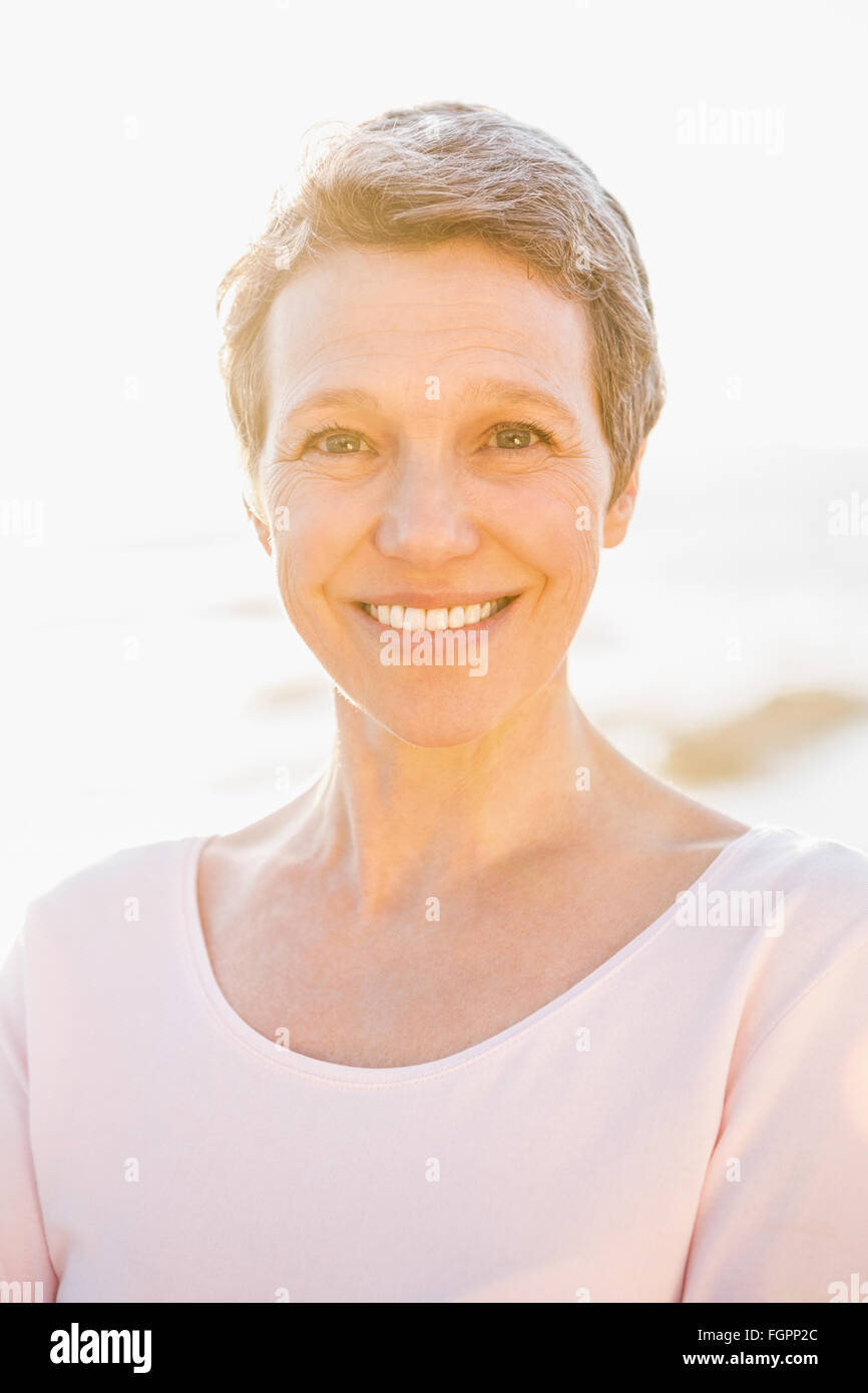 Smiling sporty woman at promenade Stock Photo Alamy