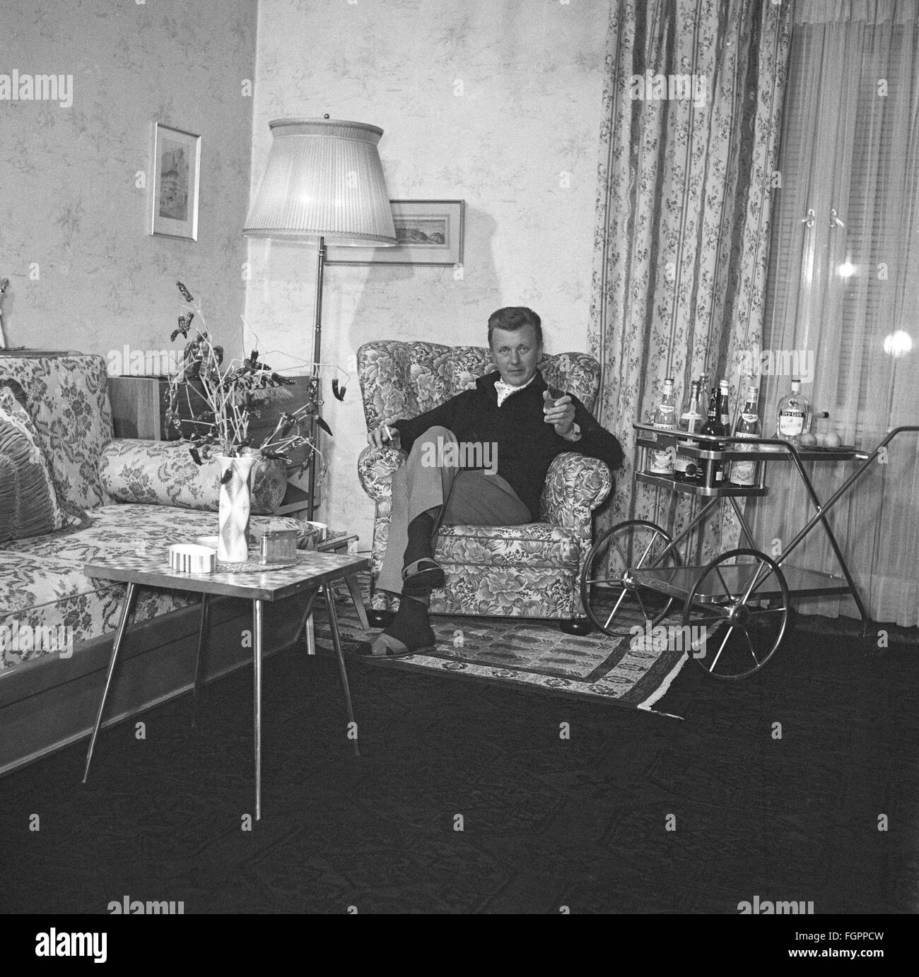 furnishings, living-room, man sitting on arm chair, 1950s, , Additional-Rights-Clearences-Not Available Stock Photo