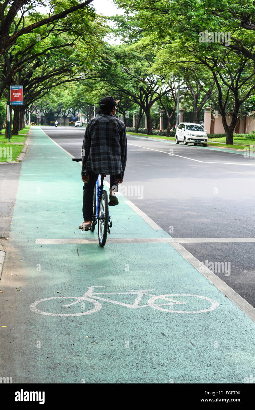 Bicycle rider on bicycle lane Stock Photo