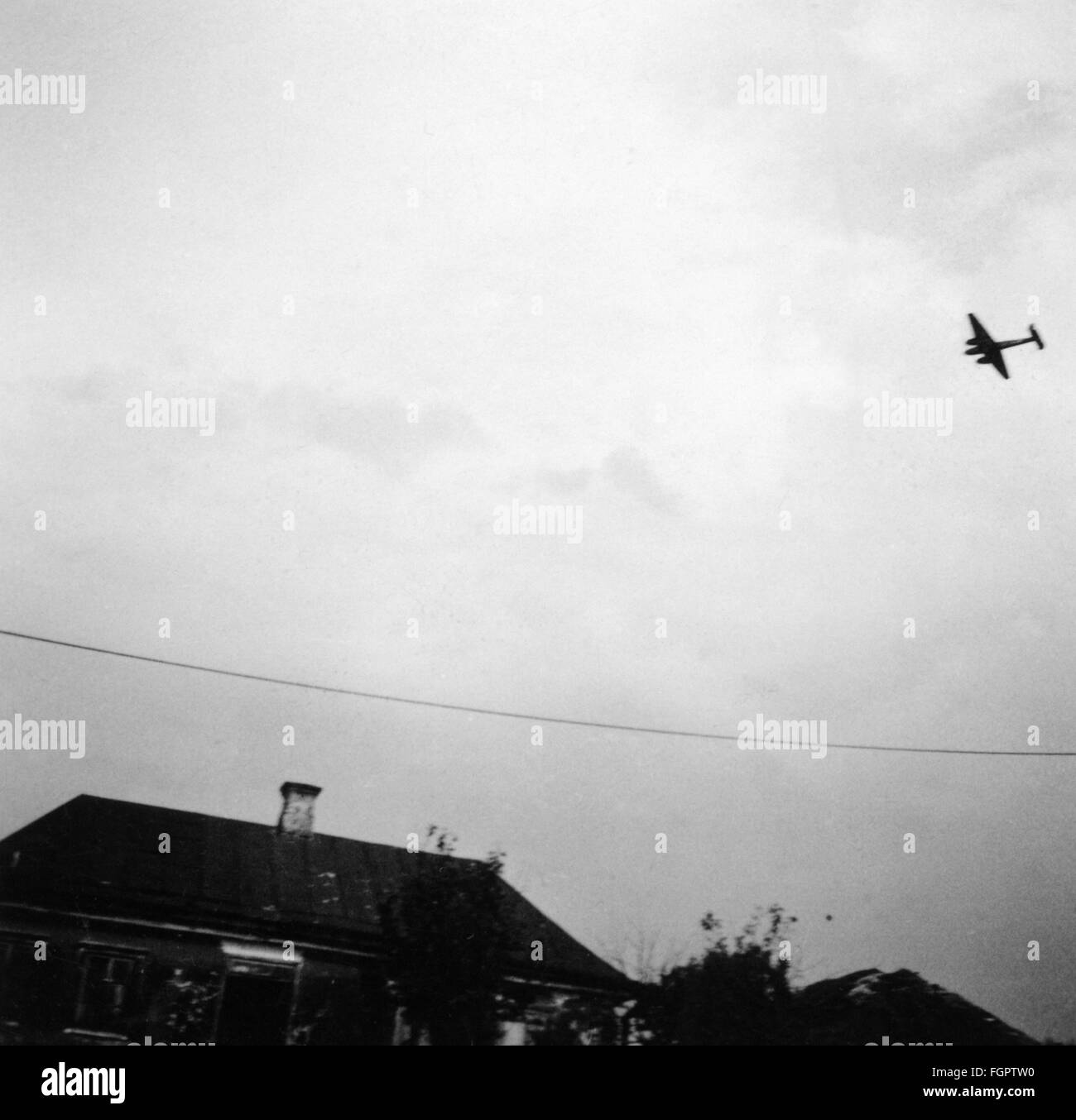 events, Second World War / WWII, aerial warfare, Soviet Union, Operation 'Barbarossa' (German Invasion of the Soviet Union), German heavy fighter Messerschmitt Bf 110 over a village in the Ukraine, 1941, Additional-Rights-Clearences-Not Available Stock Photo