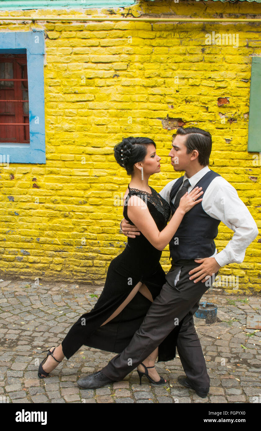 Buenos Aires Argentina La Boca tango dance with couple on street with colors worn walls with passion model released MR MR-1 man Stock Photo
