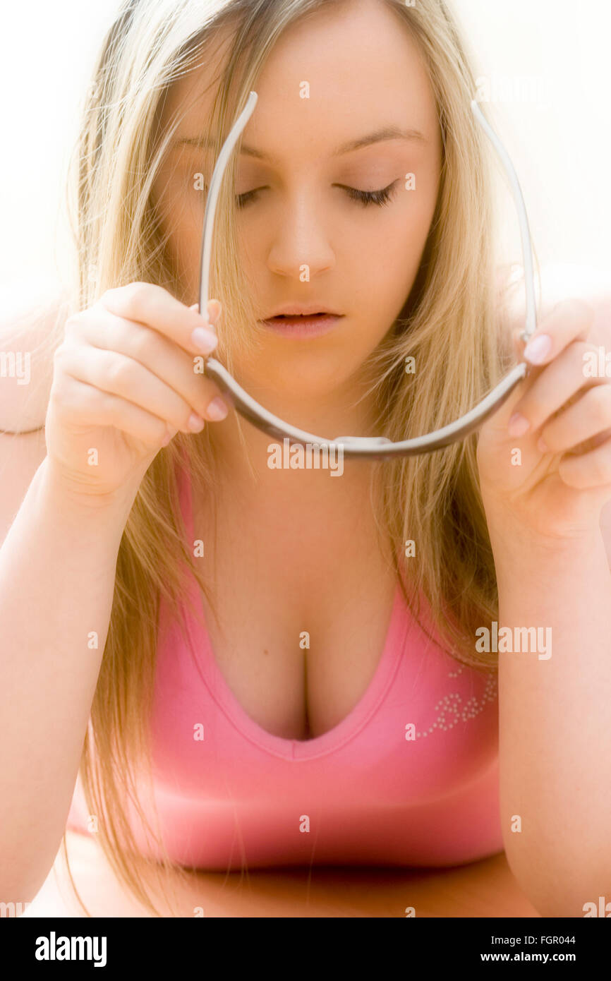 Caucasian Blonde Teenage Girl With Long Blonde Hair Facing Holding Stock Photo Alamy