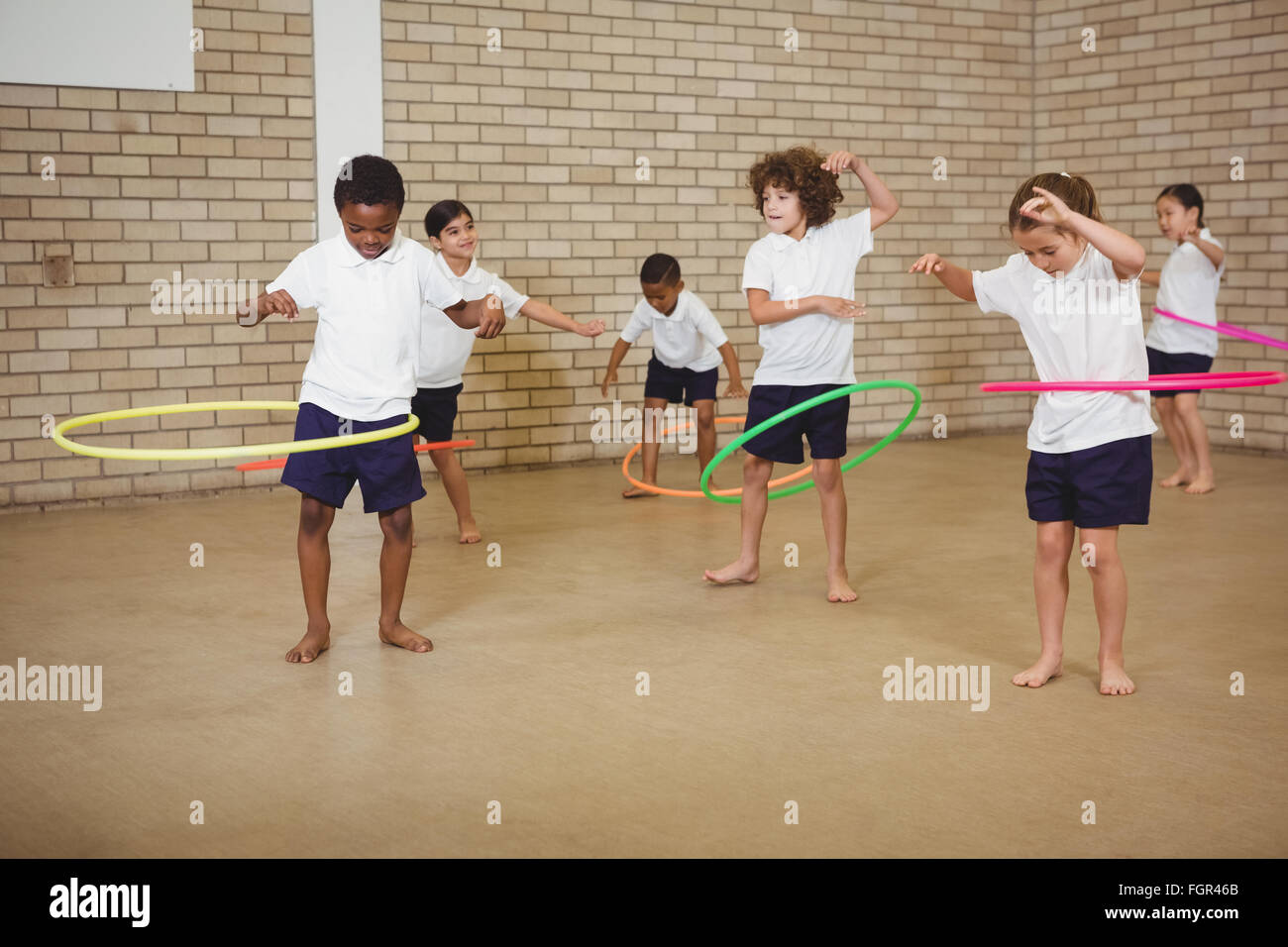 Students using some hula hoops Stock Photo