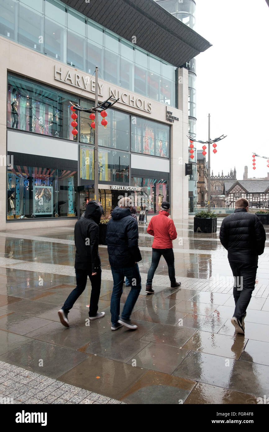 Manchester, UK - 17 February 2016: Rain on New Cathedral Street with its Harvey Nichols store Stock Photo