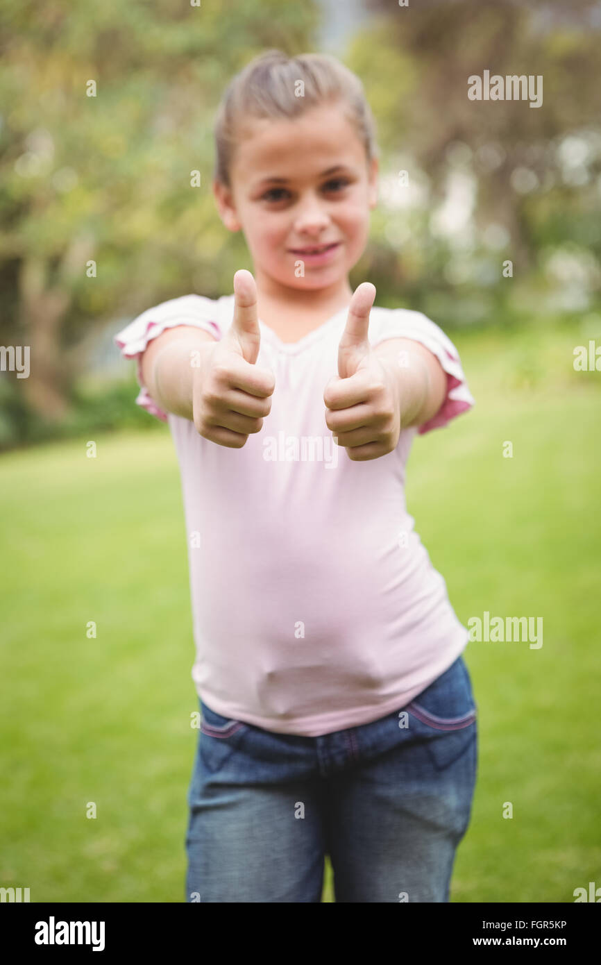 Smiling student with thumbs up Stock Photo - Alamy