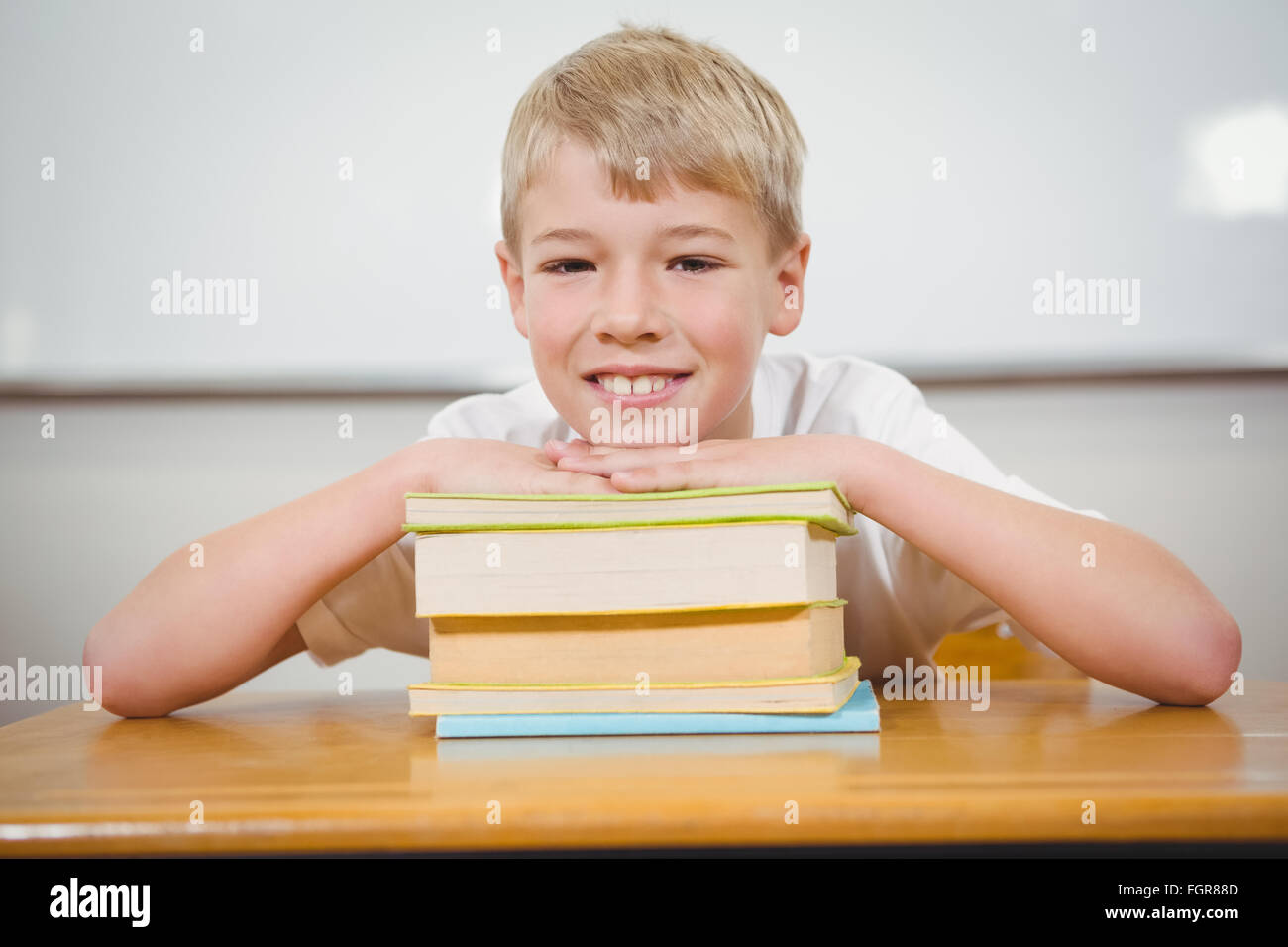 Student resting thie head upon some books Stock Photo - Alamy