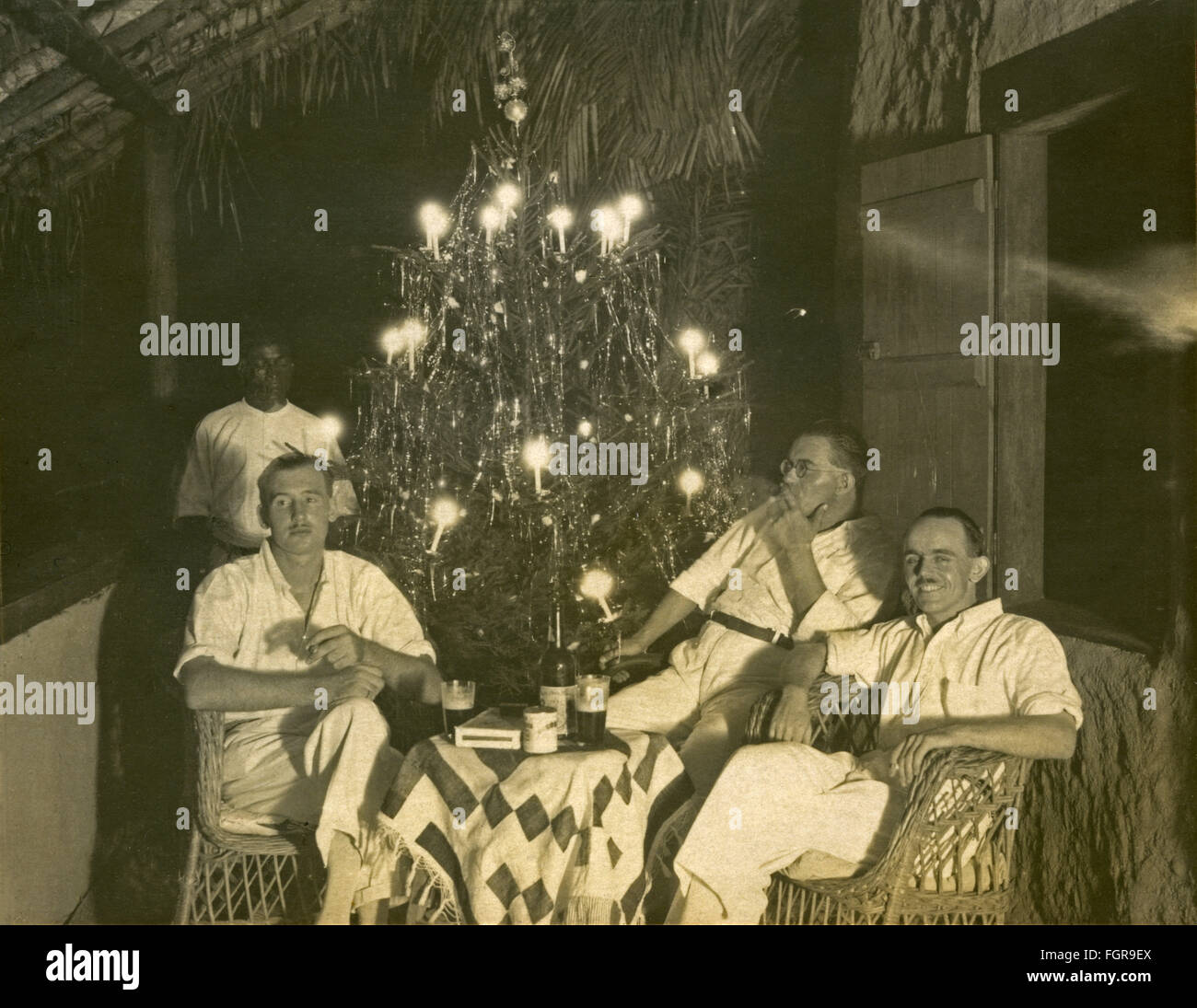 Christmas, men in colonial clothes celebrating Christmas under palm trees, Sierra Leone, Africa, Christmas 1929, Additional-Rights-Clearences-Not Available Stock Photo
