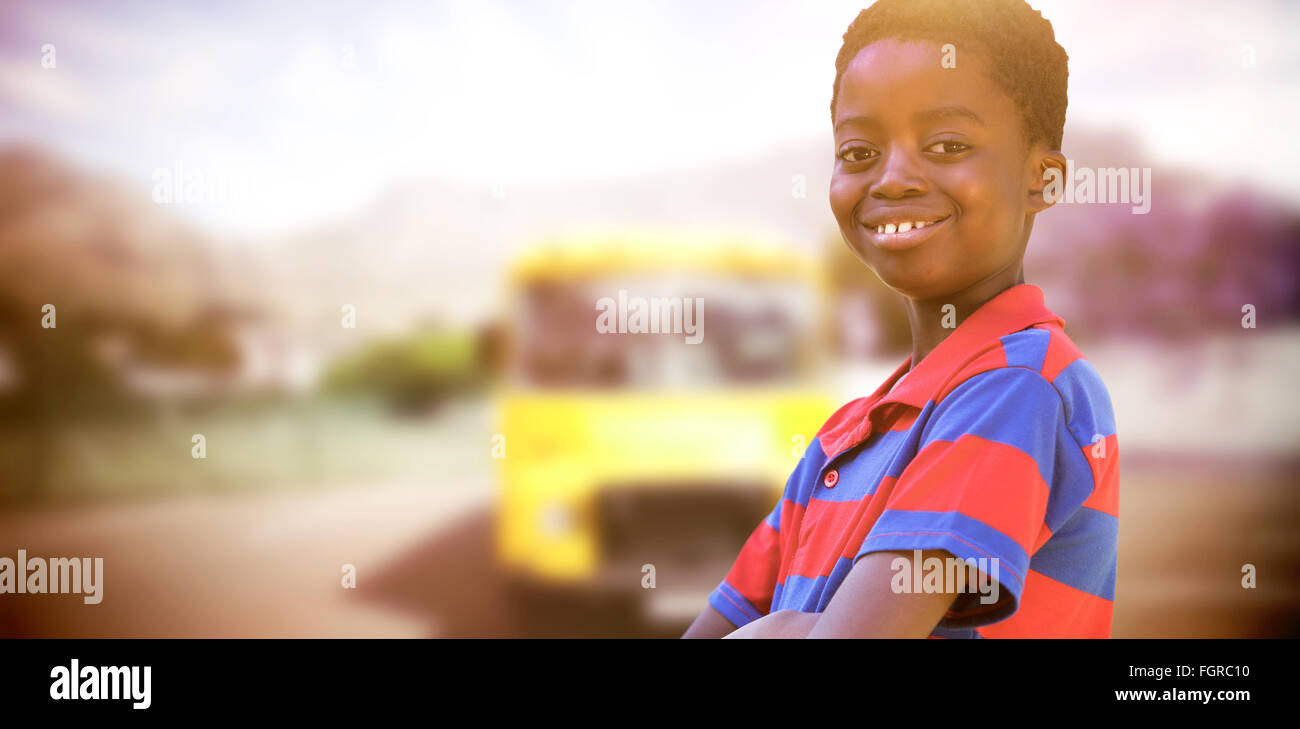 Composite image of cute little boy smiling at camera Stock Photo - Alamy