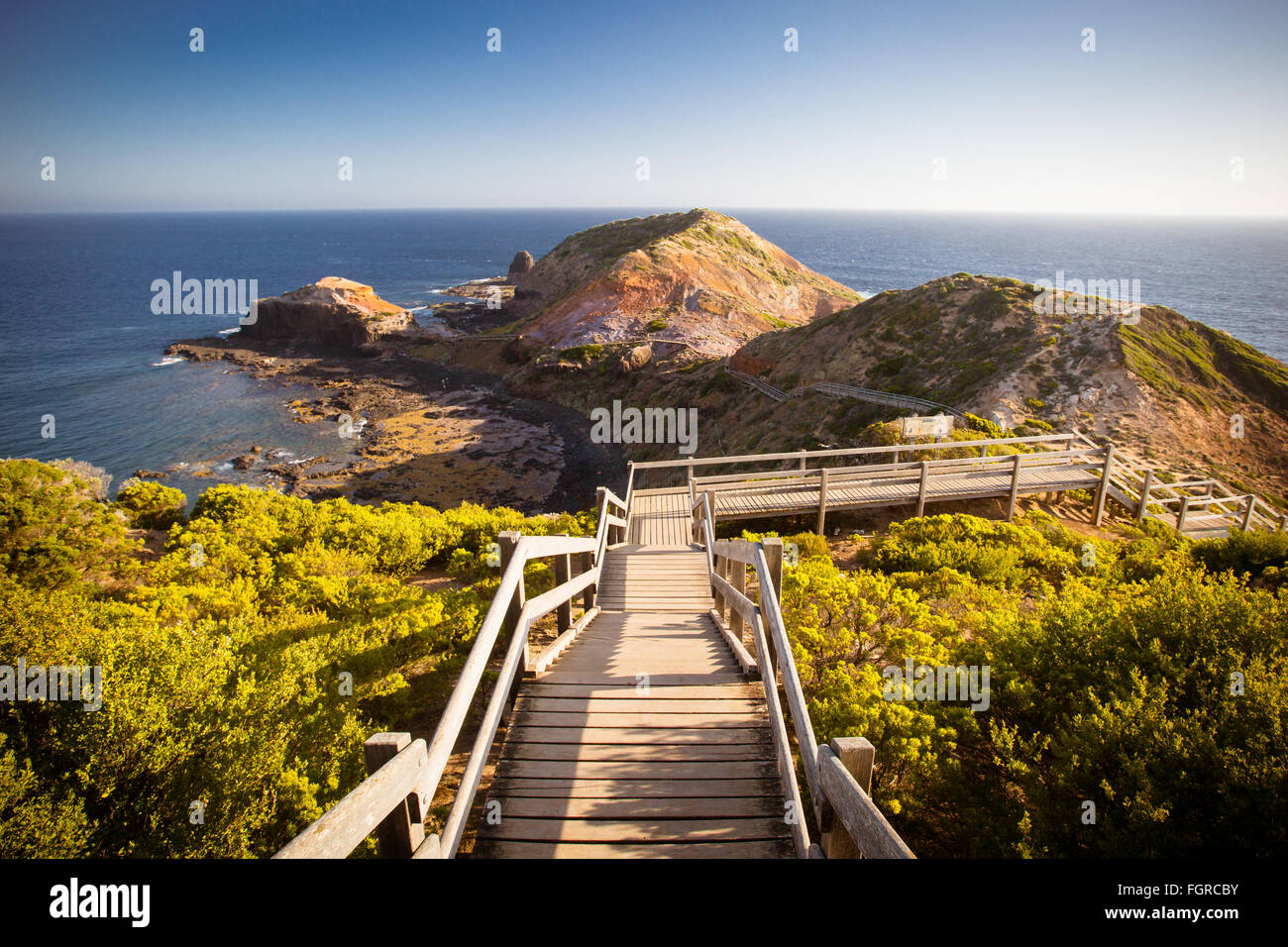 The famous Cape Schanck boardwalk runs towards the sea and rock formation known as London Bridge, in Victora. Australia Stock Photo