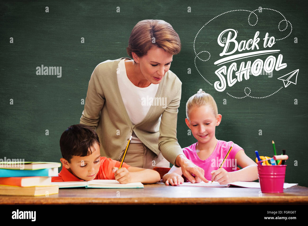 Composite image of teacher helping pupils in library Stock Photo