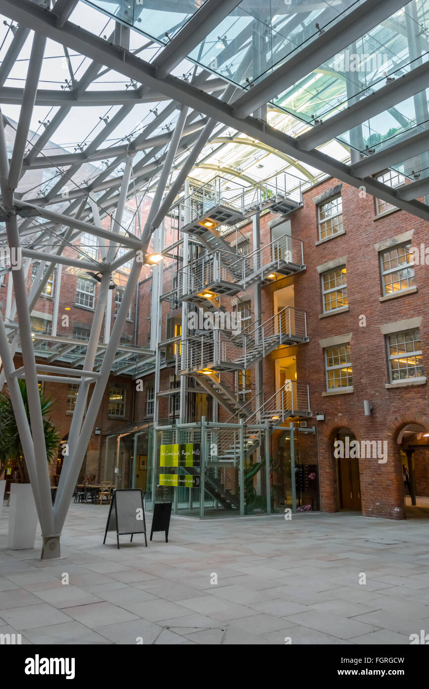 The atrium in the refurbished Royal Mills complex, Redhill Street, New Islington, Ancoats, Manchester, UK Stock Photo