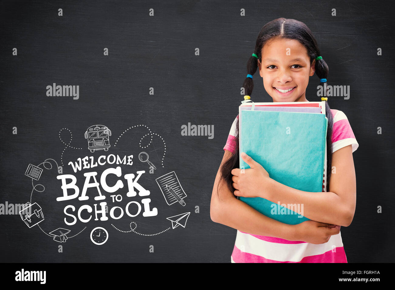 Composite image of cute pupil smiling at camera in library Stock Photo ...