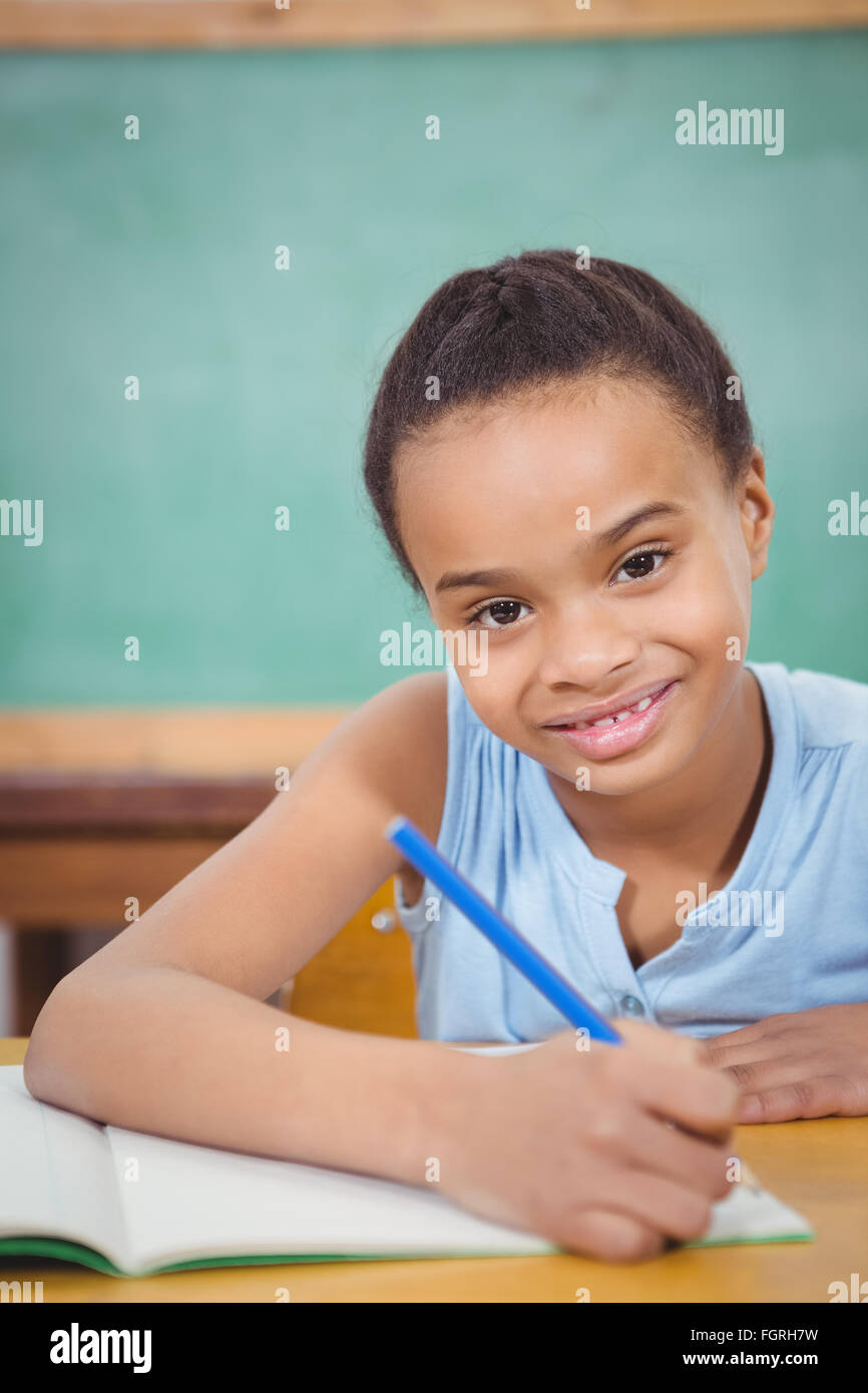 Smiling student working on school work Stock Photo Alamy
