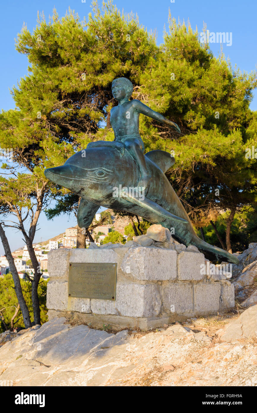 Boy on a Dolphin statue, a bronze artwork based on the film of the same name, filmed here in 1957, Hydra Island, Greece Stock Photo