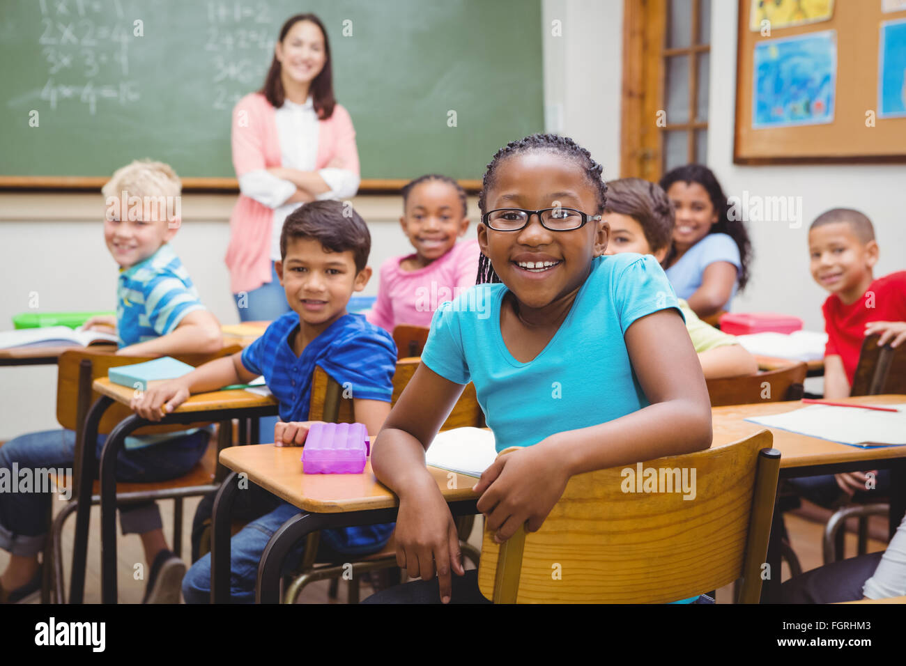 Students and teacher looking at the camera Stock Photo - Alamy