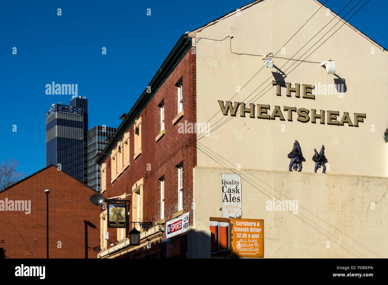 The Wheatsheaf pub and the CIS Building, from Brightwell Walk, Northern Quarter, Manchester, UK Stock Photo