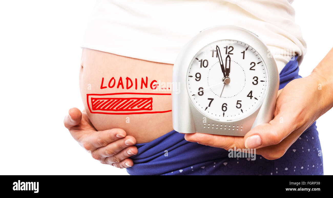 Composite image of pregnant woman showing clock and bump Stock Photo