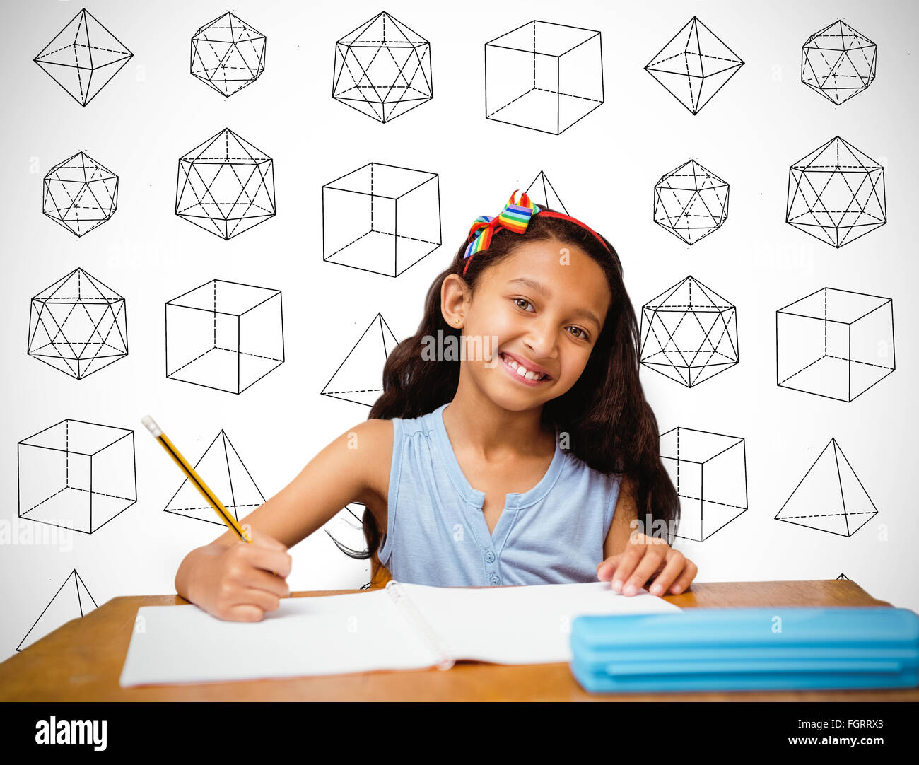Composite image of pupil at her desk Stock Photo - Alamy