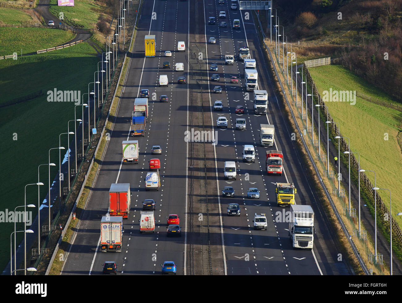 heavy traffic travelling on the m62 near moss moor huddersfield yorkshire uk Stock Photo
