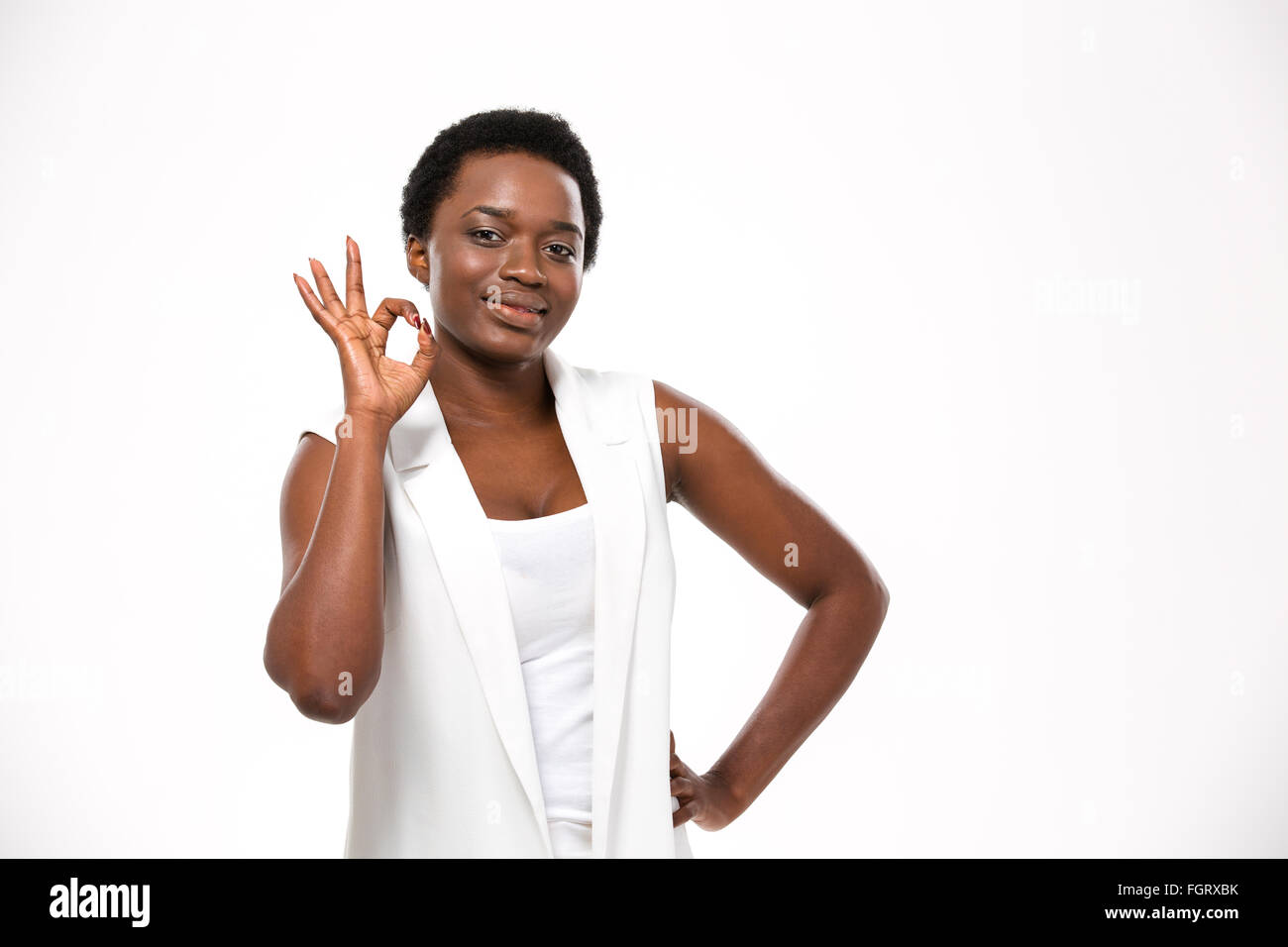 Cheerful attractive african american young woman showing ok gesture ...
