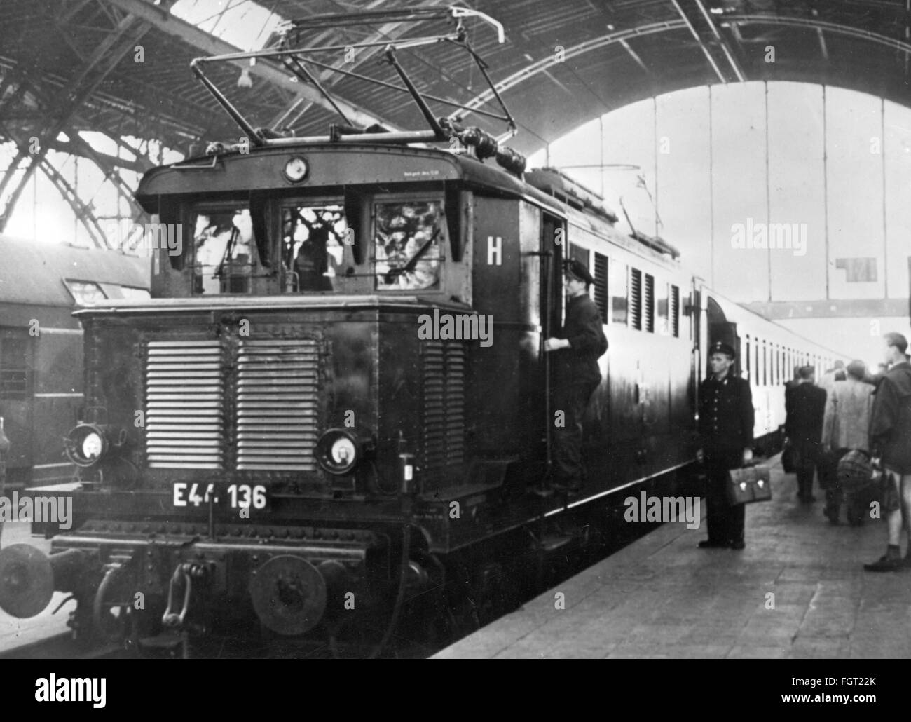 transport / transportation,railway,locomotives,electric locomotive,East German Railways,series E 44,after the first ride on the new electrified route from Bitterfeld to Leipzig,central station Leipzig,5.6.1958,loco,electric locomotive,E44,E-44,platform,platforms,staff engine driver,current collector,current collectors,electrification,fulfillment of the five-year plan,technics,technology,technologies,Saxony,Deutsche Reichsbahn,East-Germany,GDR,DDR,East Germany,Eastern Germany,Germany,1950s,50s,20th century,people,transport,tra,Additional-Rights-Clearences-Not Available Stock Photo