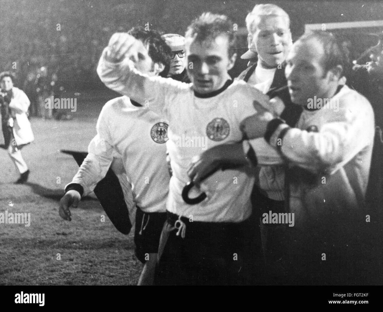 sports,football,match,international match,qualification match for the world championship 1970,Germany against Scotland,German players Wolfgang Overath,Reinhard Libuda and Uwe Seeler after the victory,Volksparkstadion,Hamburg,22.10.1969,winner,winners,cheers,jubilation,jubilance,jubilate,jubilating,cheer,cheering,frenetic,joy,happiness,happy,exhausted,mental exhaustion,fan,fanboy,fans,fanboys,German national team,qualification,qualifications,Football World Cup,Soccer World Cup,World Football Championship,soccer world champions,Additional-Rights-Clearences-Not Available Stock Photo