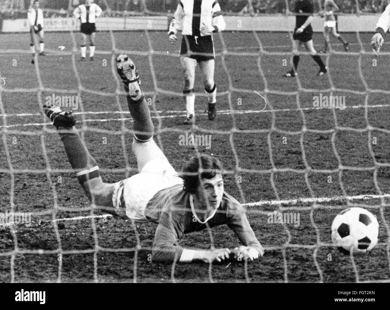 sports,football,games,Germany,DFB-Pokal,1970 / 1971,second round,game FC Schalke 04 versus VfR Heilbronn(4:0),Glückaufkampfbahn,Gelsenkirchen,20.2.1971,goal for the 2:0 for Schalke by Klaus Fischer,DFB cup,football match,soccer match,football matches,footballer,footballers,kicker,football player,football players,ball,nets,goal net,Glückauf-kampfbahn,Glückauf kampfbahn,West Germany,Western Germany,Germany,1970s,70s,20th century,people,men,man,male,football,soccer,footballs,soccer balls,second round,round before the quart,Additional-Rights-Clearences-Not Available Stock Photo
