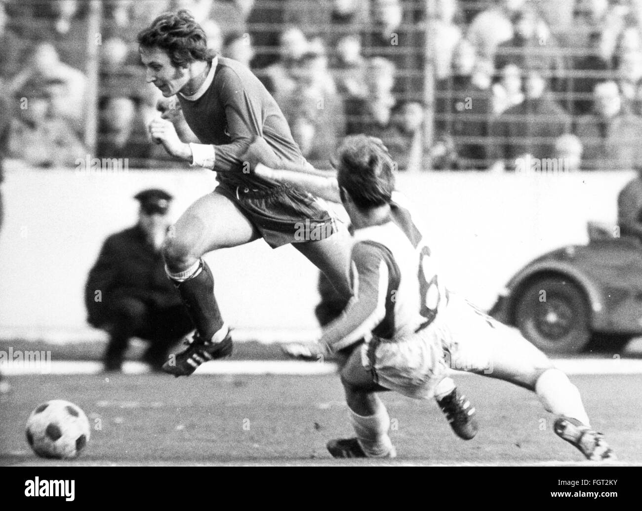 sports,football,games,Germany,national league,season 1970 / 1971,22nd match day,game 1. FC Koeln versus Hertha BSC(3: 1),Muengersdorf stadium,Cologne,27.2.1971,defender Laszlo Gergely(Hertha)tries to stop Heinz Flohe,football match,soccer match,football matches,footballer,footballers,kicker,football player,football players,action,act,actions,acts,attack,offensive move,attacks,offensive moves,defence,defense,defences,defenses,running,run,runs,ball,playing,play,keep,keeping,holding,hold,foul,fouls,West Germany,Weste,Additional-Rights-Clearences-Not Available Stock Photo