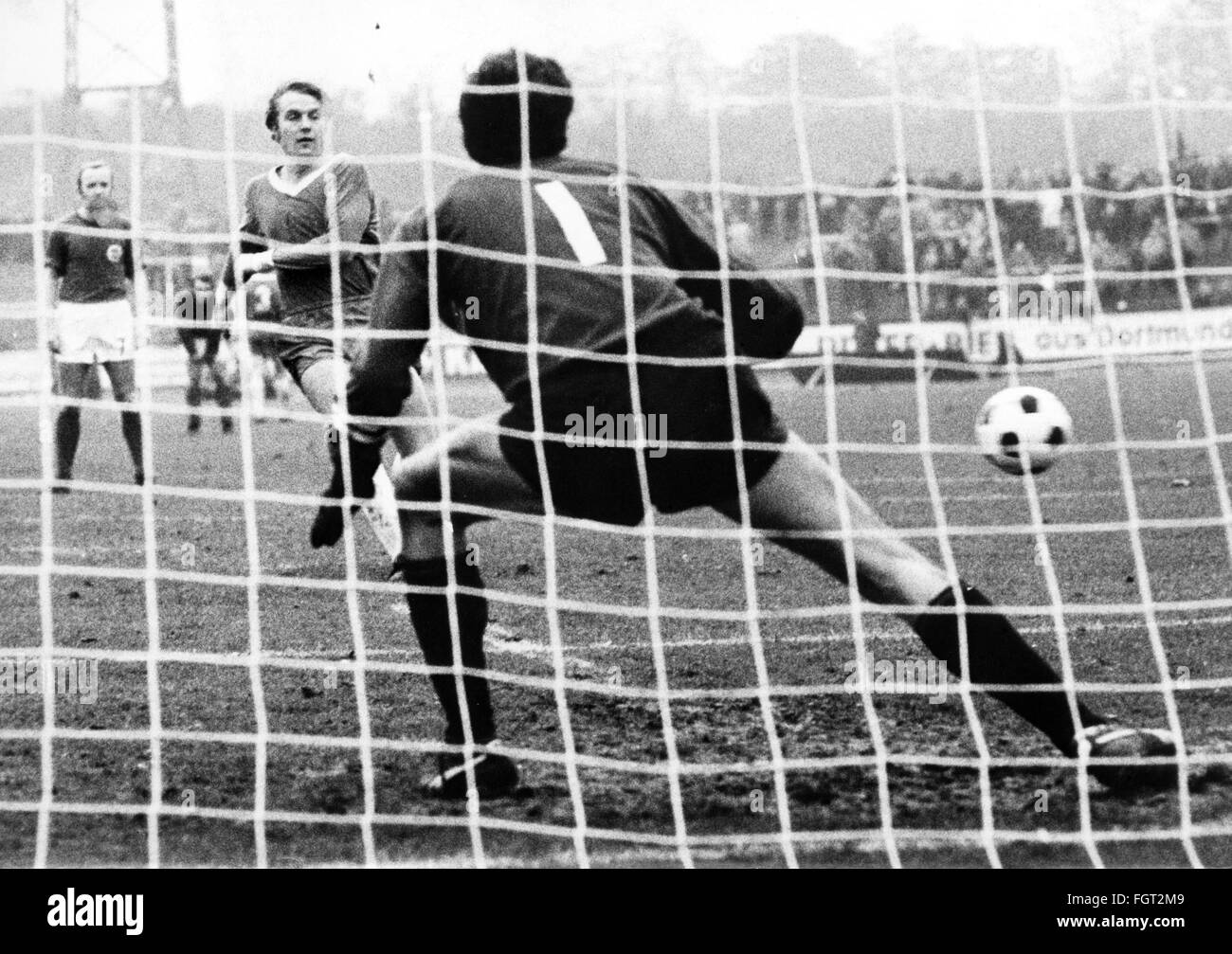 sports,football,games,Germany,national league,season 1970 / 1971,13th match day,game Rot-Weiss Oberhausen versus Kickers Offenbach(2:2),Niederrheinstadion,31.10.1970,goal to the 2:1 for Oberhausen by penalty kick of Friedhelm Kobluhm,Rot Weiss,goal keeper Karlheinz Volz,penalty shot,penalties,penalty kicks,penalty shots,nets,goal net,football match,soccer match,football matches,footballer,footballers,kicker,football player,football players,action,act,actions,acts,ball,playing,play,football stadium,soccer stadium,football sta,Additional-Rights-Clearences-Not Available Stock Photo